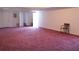 Spacious finished basement with white walls and bright lighting at 5546 Wellborn Creek Dr, Lithonia, GA 30058