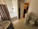 Bathroom featuring a bathtub with shower, toilet, and vanity with sink at 5546 Wellborn Creek Dr, Lithonia, GA 30058