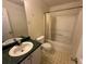 Bathroom with green countertop vanity, toilet, and shower-tub combination at 5546 Wellborn Creek Dr, Lithonia, GA 30058