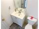 Bathroom with sink and toilet, featuring gray rug at 5546 Wellborn Creek Dr, Lithonia, GA 30058