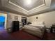 Comfortable bedroom featuring a tray ceiling and ample closet space for organized storage at 5546 Wellborn Creek Dr, Lithonia, GA 30058