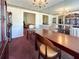 Formal dining room with large table and mirror at 5546 Wellborn Creek Dr, Lithonia, GA 30058