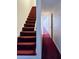 Hallway with staircase and access to other rooms at 5546 Wellborn Creek Dr, Lithonia, GA 30058