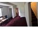 Hallway and staircase with carpeted floors, several doors, and neutral walls at 5546 Wellborn Creek Dr, Lithonia, GA 30058
