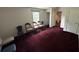 Hallway with carpeted floors, several doors, and neutral walls at 5546 Wellborn Creek Dr, Lithonia, GA 30058