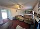 Living room offers neutral colored couches, carpet and ceiling fan at 5546 Wellborn Creek Dr, Lithonia, GA 30058