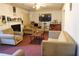 Comfortable living room with a fireplace, plush seating, and a TV above the mantel at 5546 Wellborn Creek Dr, Lithonia, GA 30058