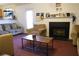 Bright living room featuring a fireplace and open layout at 5546 Wellborn Creek Dr, Lithonia, GA 30058