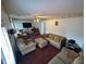 Living room offers neutral colored couches, carpet, and ceiling fan at 5546 Wellborn Creek Dr, Lithonia, GA 30058