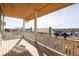 Spacious outdoor balcony with wooden ceiling and railing, offering picturesque views of the neighborhood at 1235 Lupo Loop, Palmetto, GA 30268