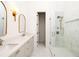 Elegant bathroom features double sinks with quartz countertops and large glass shower with marble tile at 1235 Lupo Loop, Palmetto, GA 30268