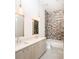 Modern bathroom features double sinks, stylish lighting fixtures, and a tiled shower at 1235 Lupo Loop, Palmetto, GA 30268