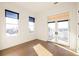 Bedroom featuring large windows and door that leads to a balcony with a view at 1235 Lupo Loop, Palmetto, GA 30268