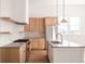 Beautiful kitchen featuring custom cabinets, a center island, stainless steel appliances, and modern pendant lighting at 1235 Lupo Loop, Palmetto, GA 30268