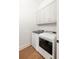 Convenient laundry room featuring modern washer and dryer with ample storage at 1235 Lupo Loop, Palmetto, GA 30268