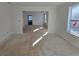 Bright bedroom with an en-suite entry, large window, and neutral color scheme at 3677 Thornhill Ct, Douglasville, GA 30135