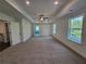 Main bedroom with tray ceilings and recessed lights. Double windows provide natural light at 3677 Thornhill Ct, Douglasville, GA 30135