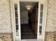 Inviting entryway with a beautiful wooden door, sidelights, and hardwood floors at 3677 Thornhill Ct, Douglasville, GA 30135