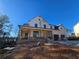 View of the new two-story home with a front porch and attached garage at 3677 Thornhill Ct, Douglasville, GA 30135