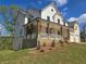 Lovely home featuring brick and siding exterior, with a welcoming porch and stone accents at 3677 Thornhill Ct, Douglasville, GA 30135