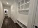 Entryway hall featuring built-in cubbies, bench, and storage space perfect for organizing coats and shoes at 3677 Thornhill Ct, Douglasville, GA 30135