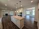 Gourmet kitchen with granite counters, island, and modern appliances, perfect for entertaining at 3677 Thornhill Ct, Douglasville, GA 30135