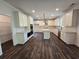 Spacious kitchen featuring white cabinets, granite counters, and hardwood floors at 3677 Thornhill Ct, Douglasville, GA 30135