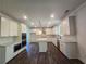 Modern kitchen with white cabinetry, stainless steel appliances, and hardwood floors at 3677 Thornhill Ct, Douglasville, GA 30135