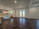 Bright, open kitchen with hardwood floors, an island, and modern white cabinets, and stainless steel appliances at 3677 Thornhill Ct, Douglasville, GA 30135