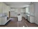 Bright kitchen with white cabinets, an island, and plenty of counter space at 3677 Thornhill Ct, Douglasville, GA 30135