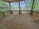 View of a spacious wooden porch overlooking lush greenery and providing a peaceful outdoor retreat at 3677 Thornhill Ct, Douglasville, GA 30135