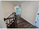 View of a staircase with dark wood railings leading to the second floor of a house at 3677 Thornhill Ct, Douglasville, GA 30135