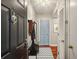 Inviting condo entryway with wood floors, coat rack, stylish decor, and a bright, welcoming atmosphere at 1280 W Peachtree Nw St # 3414, Atlanta, GA 30309