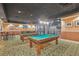 Community game room with two pool tables, high top seating and wall decor at 1280 W Peachtree Nw St # 3414, Atlanta, GA 30309