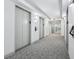Elegant hallway with carpet, recessed lighting, elevator access and bright white walls at 1280 W Peachtree Nw St # 3414, Atlanta, GA 30309