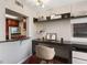Efficient home office space with built-in shelving, stylish decor, and a convenient pass-through to kitchen at 1280 W Peachtree Nw St # 3414, Atlanta, GA 30309