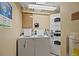 Community laundry room featuring multiple washers and dryers for residents to use at 1280 W Peachtree Nw St # 3414, Atlanta, GA 30309