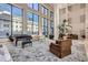 Bright lobby with large windows, piano, and comfortable seating, creating an inviting atmosphere at 1280 W Peachtree Nw St # 3414, Atlanta, GA 30309
