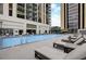 Inviting pool area with lounge chairs perfect for relaxation and enjoying the sunny weather at 1280 W Peachtree Nw St # 3414, Atlanta, GA 30309