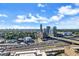 Panoramic aerial view of the city skyline and surrounding green landscape at 1280 W Peachtree Street Nw, Unit #3414, Atlanta, GA 30309