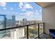 Breathtaking balcony view of the city skyline on a sunny day at 1280 W Peachtree Street Nw, Unit #3414, Atlanta, GA 30309