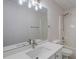 Bathroom with new white sink vanity, new light fixture and shower/tub combo at 902 Tree Creek Blvd # 2, Lawrenceville, GA 30043