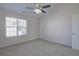 Bedroom with ceiling fan, large window and door to the closet at 902 Tree Creek Blvd # 2, Lawrenceville, GA 30043