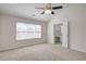 Bright bedroom with vaulted ceiling, fan, walk-in closet and large window at 902 Tree Creek Blvd # 2, Lawrenceville, GA 30043