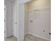 Walk-in closet with a door to enter the room, and a metal rack at 902 Tree Creek Blvd # 2, Lawrenceville, GA 30043