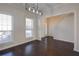 Bright entryway featuring hardwood floors, fresh paint, and modern lighting at 902 Tree Creek Blvd # 2, Lawrenceville, GA 30043