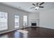Cozy living room showcasing hardwood floors, a fireplace, and a bright ambiance at 902 Tree Creek Blvd # 2, Lawrenceville, GA 30043