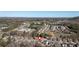 Aerial view showcasing the home's position in a community close to wooded areas, shopping, and major roadways at 138 Lakestone Pkwy, Woodstock, GA 30188