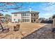 Home exterior with a spacious backyard including a swing set, a patio, and manicured landscaping at 138 Lakestone Pkwy, Woodstock, GA 30188