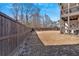 Spacious, fenced backyard with a swing set, offering plenty of room for outdoor activities and enjoyment at 138 Lakestone Pkwy, Woodstock, GA 30188